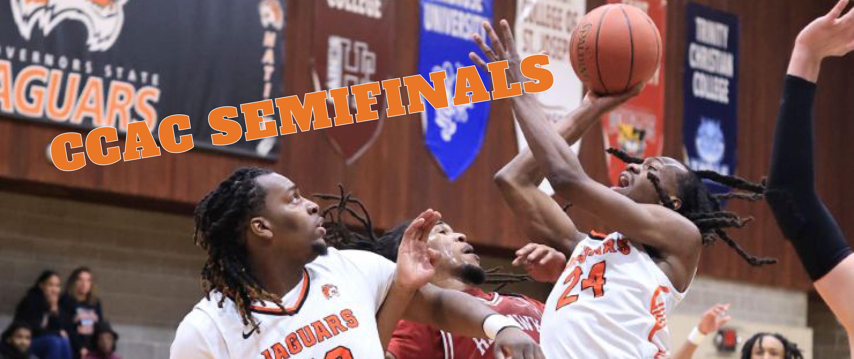 A group of men playing basketball